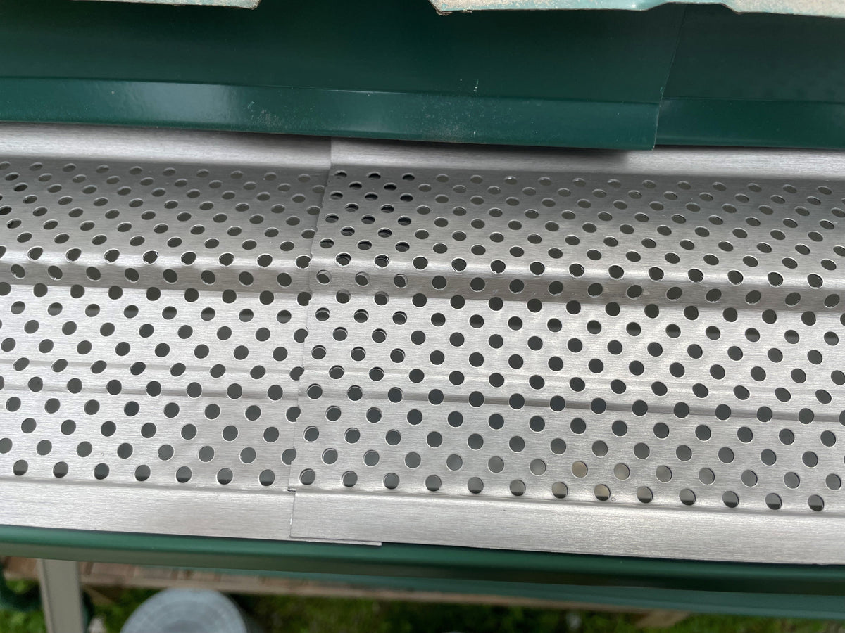 Close up of mill finish aluminum gutter guard