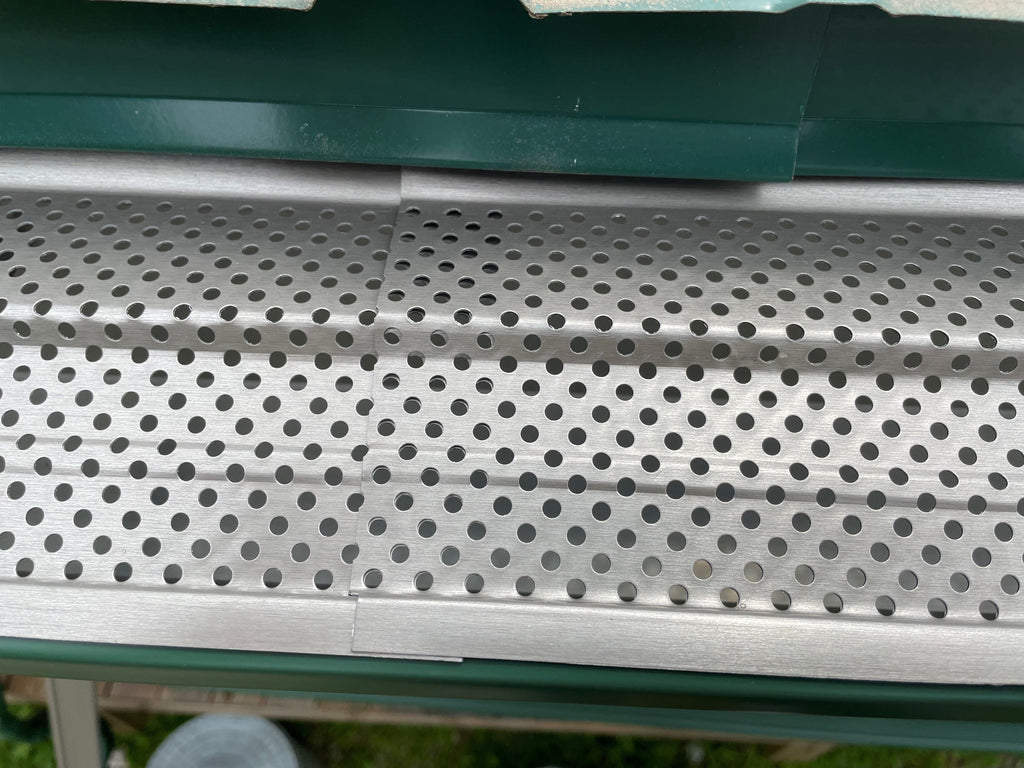 Close up of mill finish aluminum gutter guard